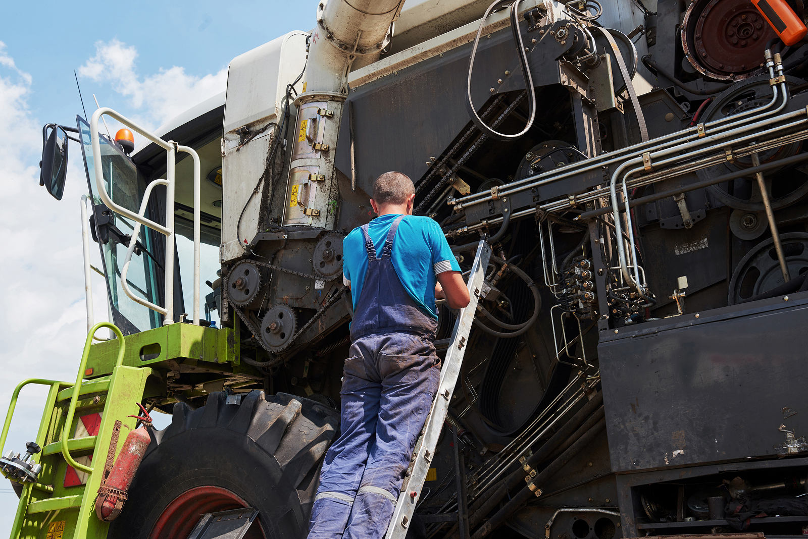 Service crew maintaining heavy equipment